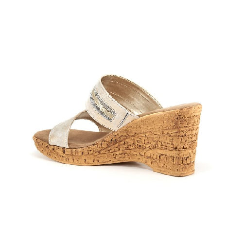 Two strap high heel slide in platinum with cork wedge.