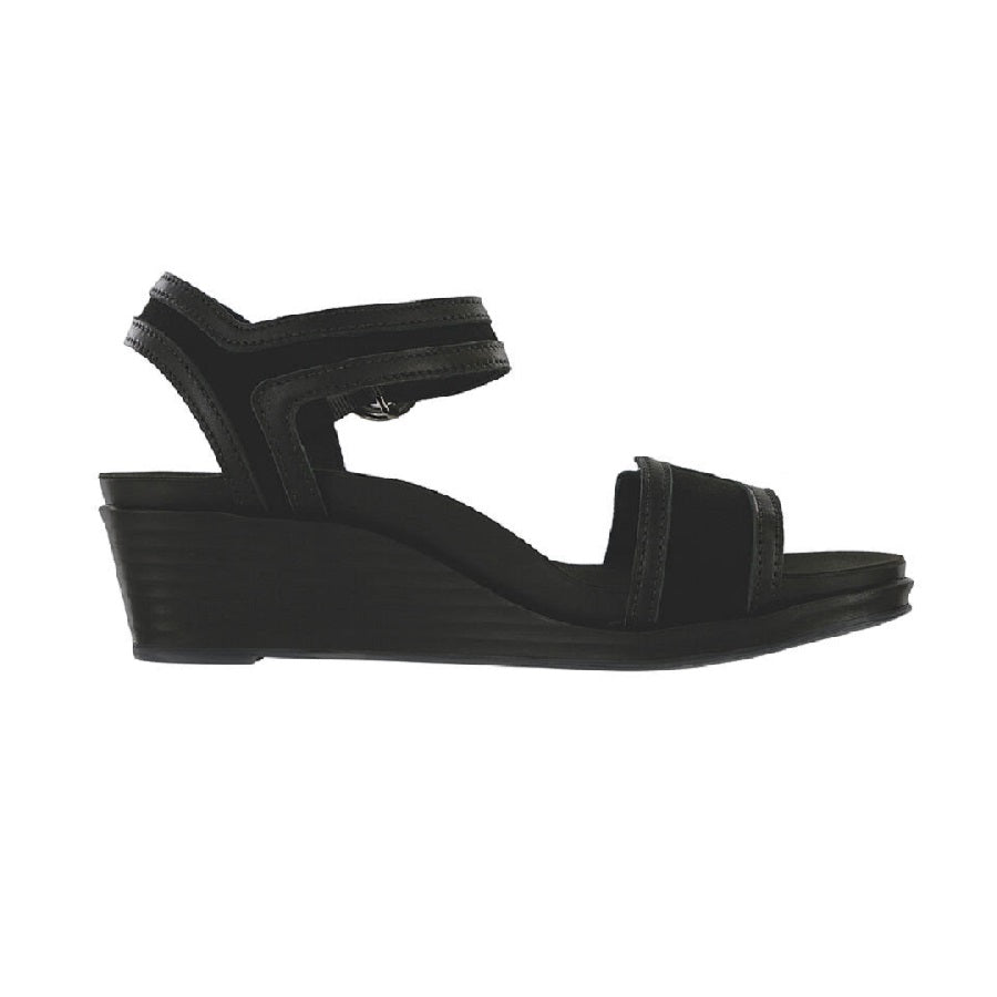 Wedge sandal with black straps and buckle accent.